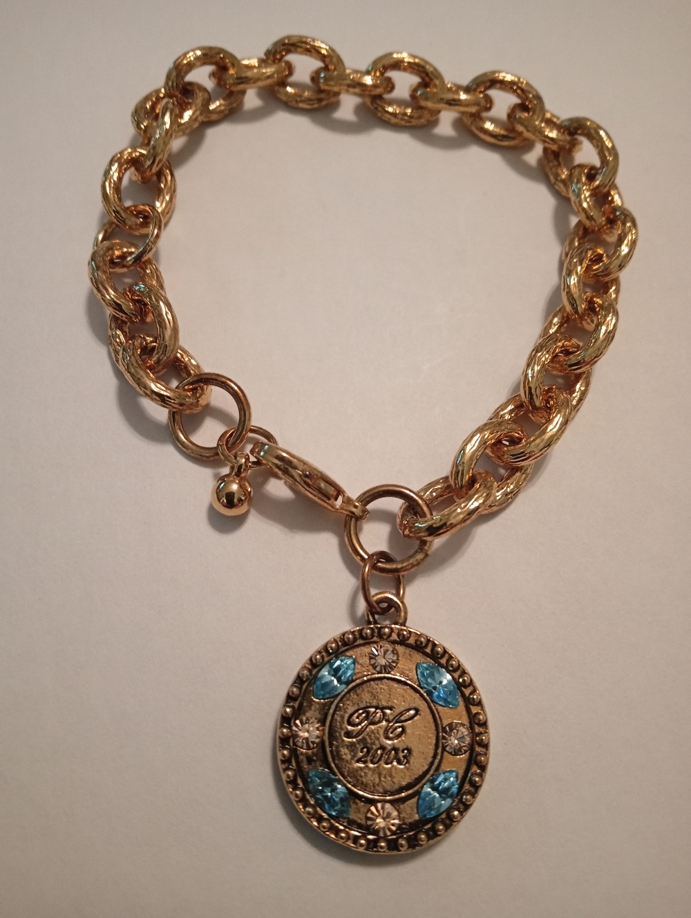 #1178.  Avon 2003 Presidents Club Blue & Clear Rhinestone, Gold Toned Bracelet.